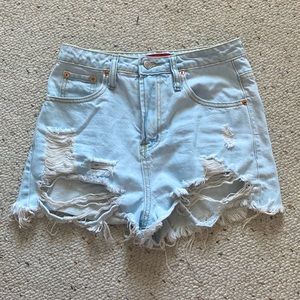 Light wash ripped Jean shorts. Size small